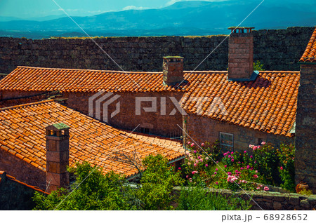 Chimneys on roofs of old houses 68928652