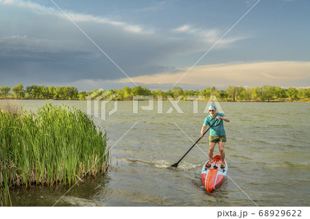 solo senior male stand up paddler solo senior male stand up paddler 68929622