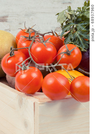 Fruits with vegetables in wooden box 68937960