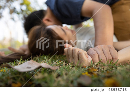 Hands of aggressive male holding a female hand for rape or sexual abuse,social problems,sexual assault,rape victim girl on the ground with man rapist,stop violence,abuse and sexual harassment concept 68938718
