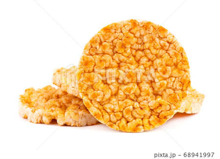Caramelized rice-corn crispbread, isolated on white background. Sweet puffed whole grain crispbread. 68941997