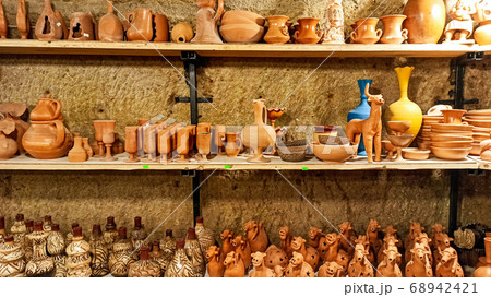 Rustic handmade brown terracotta vases and cups at the pottery shop in Avanos. Ceramic clay souvenirs at handicraft market in Cappadocia, Turkey 68942421