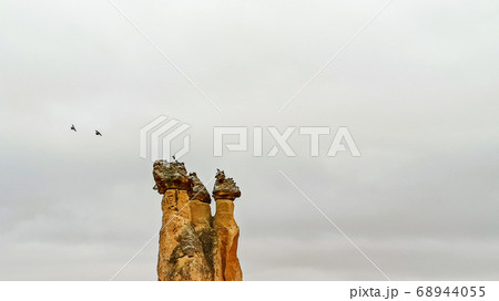 Fairy Chimneys at Pasabag, the valley of the monks in Goreme. Rock Formations with multihead stone mushroom fairy chimneys in Pasabag, Cappadocia, Turkey Fairy Chimneys at Pasabag, the valley of the monks in Goreme. Rock Formations with multihead stone mushroom fairy chimneys in Pasabag, Cappadocia, Turkey 68944055