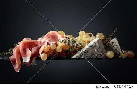 Grapes with blue cheese, prosciutto and thyme. 68944417