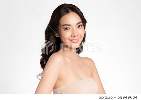 Beautiful Young asian Woman with Clean Fresh Skin, on white background, Face care, Facial treatment. Beautiful Young asian Woman with Clean Fresh Skin, on white background, Face care, Facial treatment. 68949604