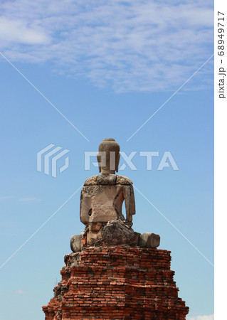 The back of the Buddha statue on blue sky background at Chaiwatthanaram temple The back of the Buddha statue on blue sky background at Chaiwatthanaram temple 68949717