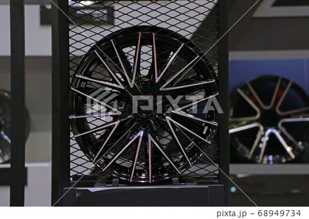 Alloy Wheel of car on the shelf. Alloy wheels are wheels that are made from an alloy of aluminium 68949734