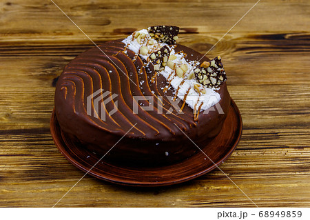 Tasty chocolate cake on a wooden table 68949859