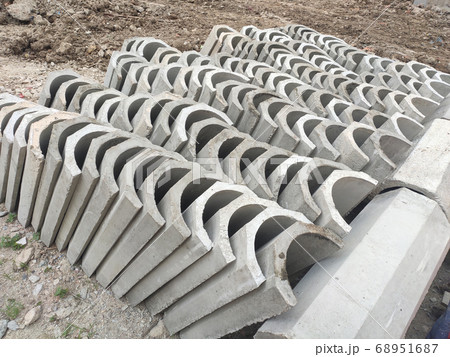 SEREMBAN, MALAYSIA -AUGUST 28, MALAYSIA: U shape precast drain at the construction site. Built of reinforced concrete. These materials are collected and stacked on top of each other before installing. SEREMBAN, MALAYSIA -AUGUST 28, MALAYSIA: U shape precast drain at the construction site. Built of reinforced concrete. These materials are collected and stacked on top of each other before installing. 68951687