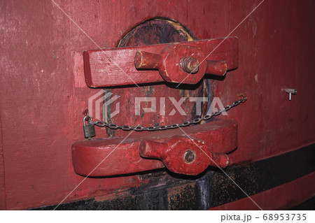 Maintenance hatch in an old wood storage tank 68953735