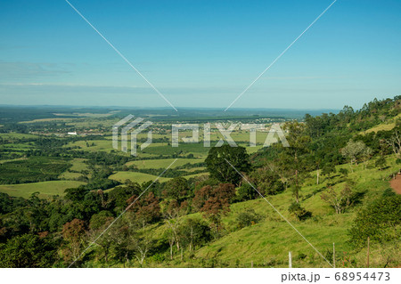 Green valley with hills and meadow Green valley with hills and meadow 68954473