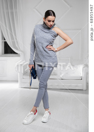 Beautiful lady dressed in a sweater 68955497