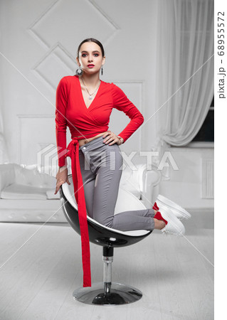 Nice woman wearing a a red blouse Nice woman wearing a a red blouse 68955572