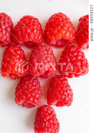 Beautiful raspberries in triangle shape lies Beautiful raspberries in triangle shape lies 68958327