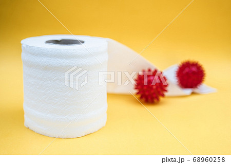 Toilet paper isolated on a yellow background 68960258