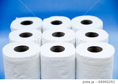 Toilet paper isolated on a blue background Toilet paper isolated on a blue background 68960262