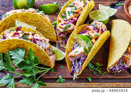 salmon tacos with shredded red cabbage salad 68963858