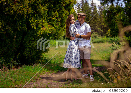 couple in love holds hands and looking at each 68966209