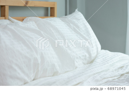 Messed bed with white pillow and blanket with natural light in bedroom in the morning, Messed bed with white pillow and blanket with natural light in bedroom in the morning, 68971045