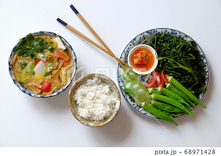 vegan daily meal for lunch time, boiled okra, water spinach, cucumber with tofu cheese, rice bowl, vegetables soup, simple vegetarian healthy diet vegan daily meal for lunch time, boiled okra, water spinach, cucumber with tofu cheese, rice bowl, vegetables soup, simple vegetarian healthy diet 68971428