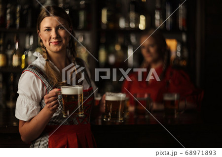 Oktoberfest woman with beer Oktoberfest woman with beer 68971893