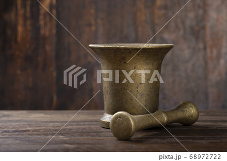 brass mortar for chopping herbs or for spices on a brass mortar for chopping herbs or for spices on a 68972722