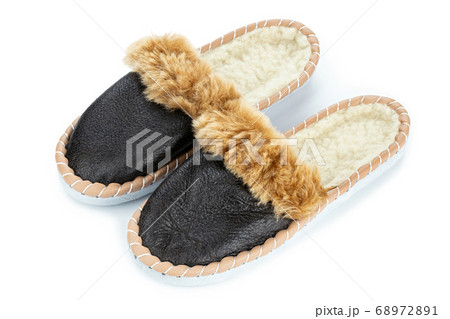 Warm indoor slippers on a white background. Clear Warm indoor slippers on a white background. Clear 68972891