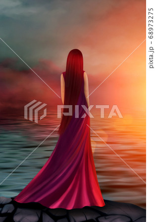 Beautiful girl in a long red dress in the rays of 68973275