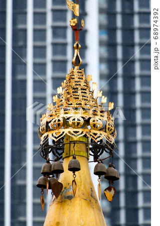 Decorative golden turret in a Buddhist monastery Decorative golden turret in a Buddhist monastery 68974392
