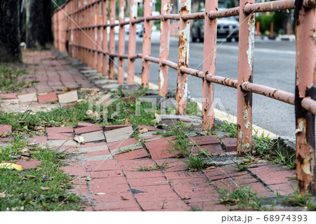 Broken walkway in Penang city. Damaged pavement on Broken walkway in Penang city. Damaged pavement on 68974393