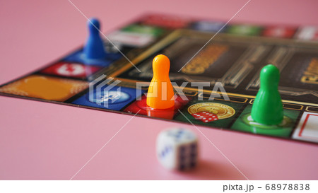 Colored board game figures with dice Colored board game figures with dice 68978838