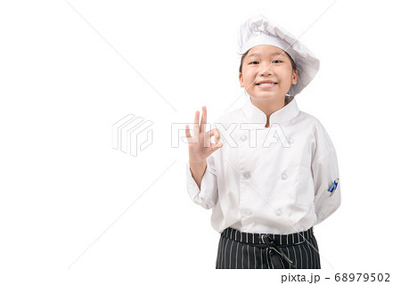 Happy asian girl chef in uniform showing OK sign Happy asian girl chef in uniform showing OK sign 68979502