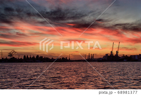 Red Sunset on the river on summer. Beautiful vew Red Sunset on the river on summer. Beautiful vew 68981377