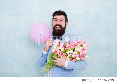 Shower love upon her with flowers. Happy hipster Shower love upon her with flowers. Happy hipster 68982249