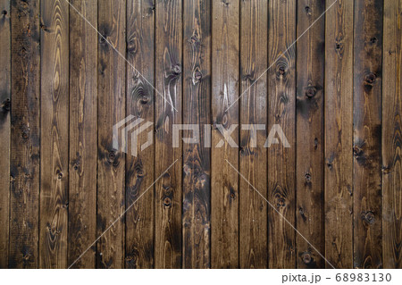 Picture of wooden dark brown wall with vertical stripes 68983130