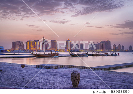 Katara beach in Doha, Qatar  sunset view with dhows in the Arabic gulf and clouds in the sky in background 68983896
