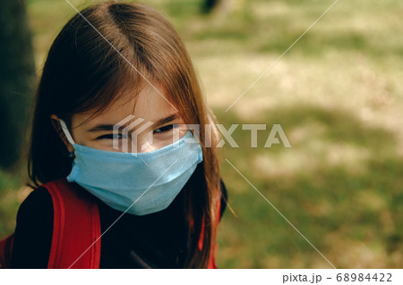 Back to school. Girl in protective mask. Back to school. Girl in protective mask. 68984422