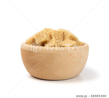 Raw Brown Cane Sugar Isolated on White Background Raw Brown Cane Sugar Isolated on White Background 68985400