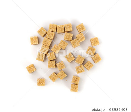 Raw Brown Cane Sugar Cubes Isolated on White Raw Brown Cane Sugar Cubes Isolated on White 68985403