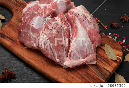 Fresh raw beef steak on black stone background 68985592