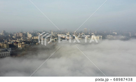 Aerial view of the city in the fog. 68987438