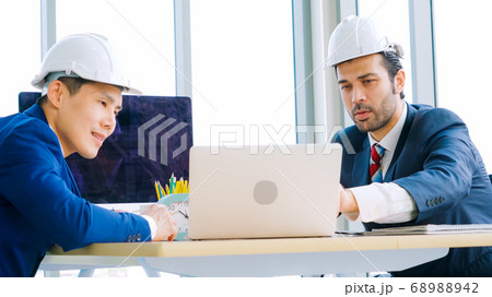 Engineer and architect meeting at office table Engineer and architect meeting at office table 68988942