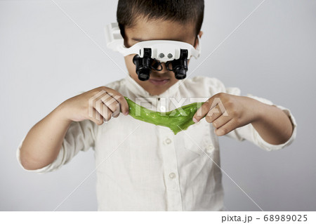 Schoolboy conducting scientific experiments Schoolboy conducting scientific experiments 68989025