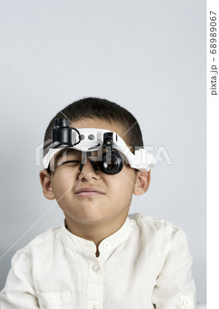 Portrait of a cute boy looking like a superspy 68989067