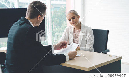 Job seeker in job interview meeting with manager Job seeker in job interview meeting with manager 68989407
