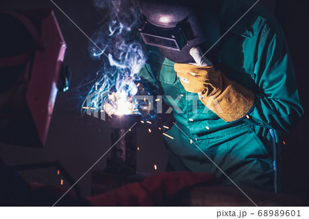 Metal welding steel works using electric arc welding machine Metal welding steel works using electric arc welding machine 68989601