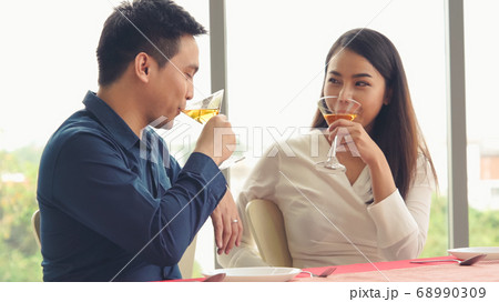 Happy romantic couple eating lunch at restaurant 68990309