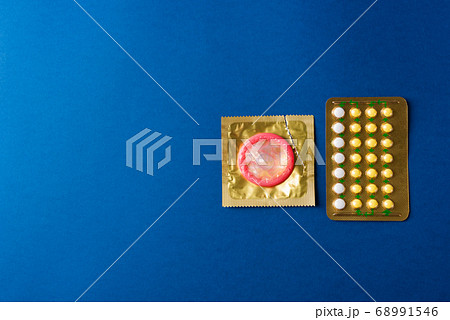 condom on wrapper pack and contraceptive pills 68991546