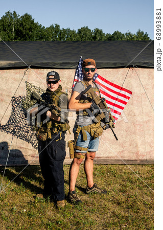 Young friends with rifles 68993881