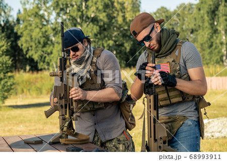 Checking rifles before shooting 68993911